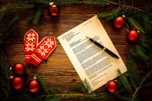 grafika prezentująca świąteczny list ministry Mai Nowak do osób z niepełnosprawnością i ich najbliższych. Na grafice znajdują się również gałązki choinki z bombkami oraz zimowe rękawiczki