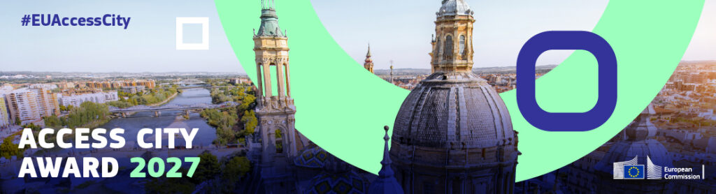 W tle panorama europejskiego miasta z zabytkowymi wieżami i rzeką