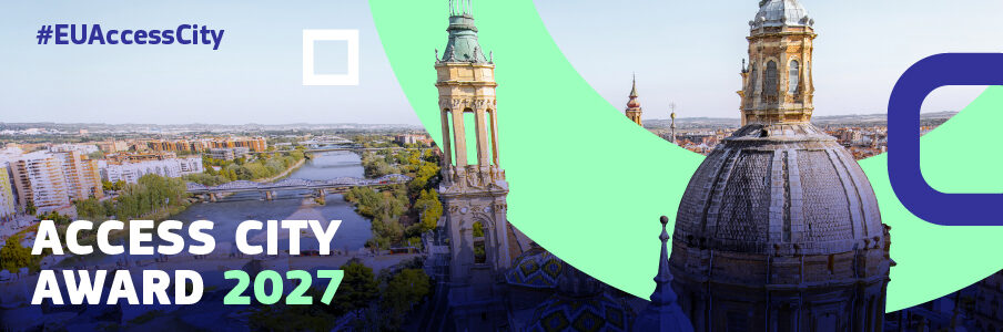 W tle panorama europejskiego miasta z zabytkowymi wieżami i rzeką